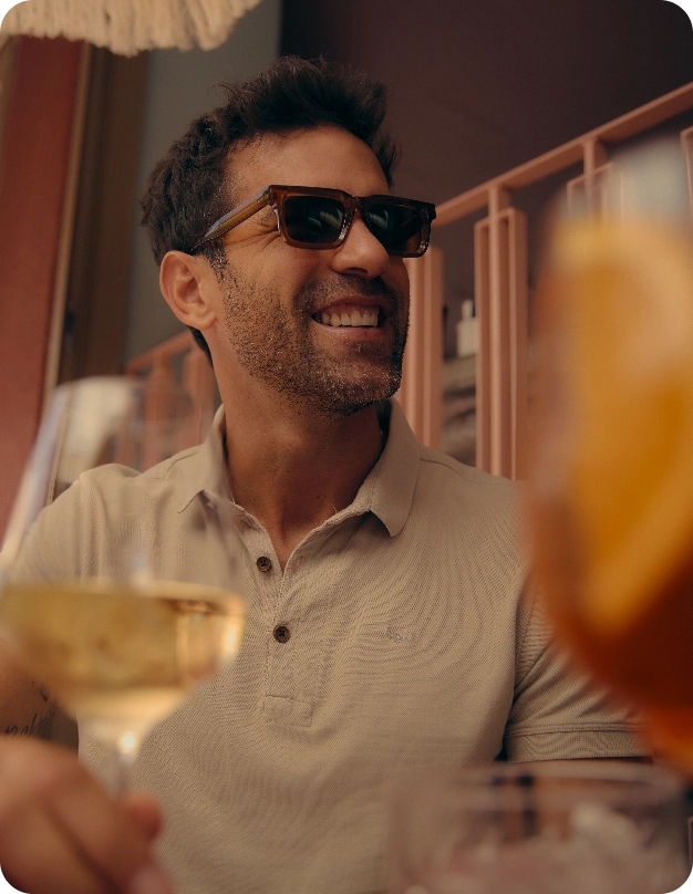 Man drinking wine at cafe